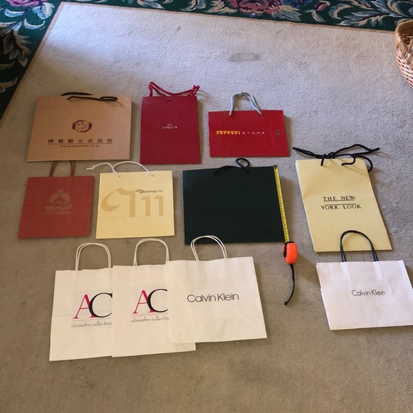 Rolex Handbags - 11 designer Rolex Chanel Ferrari Omega shop bags